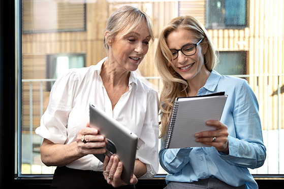 Program Quality and Evaluation Two women looking at notepads